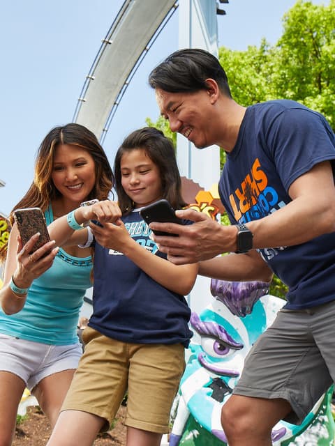 guests using the hersheypark app outside reeses cupfusion