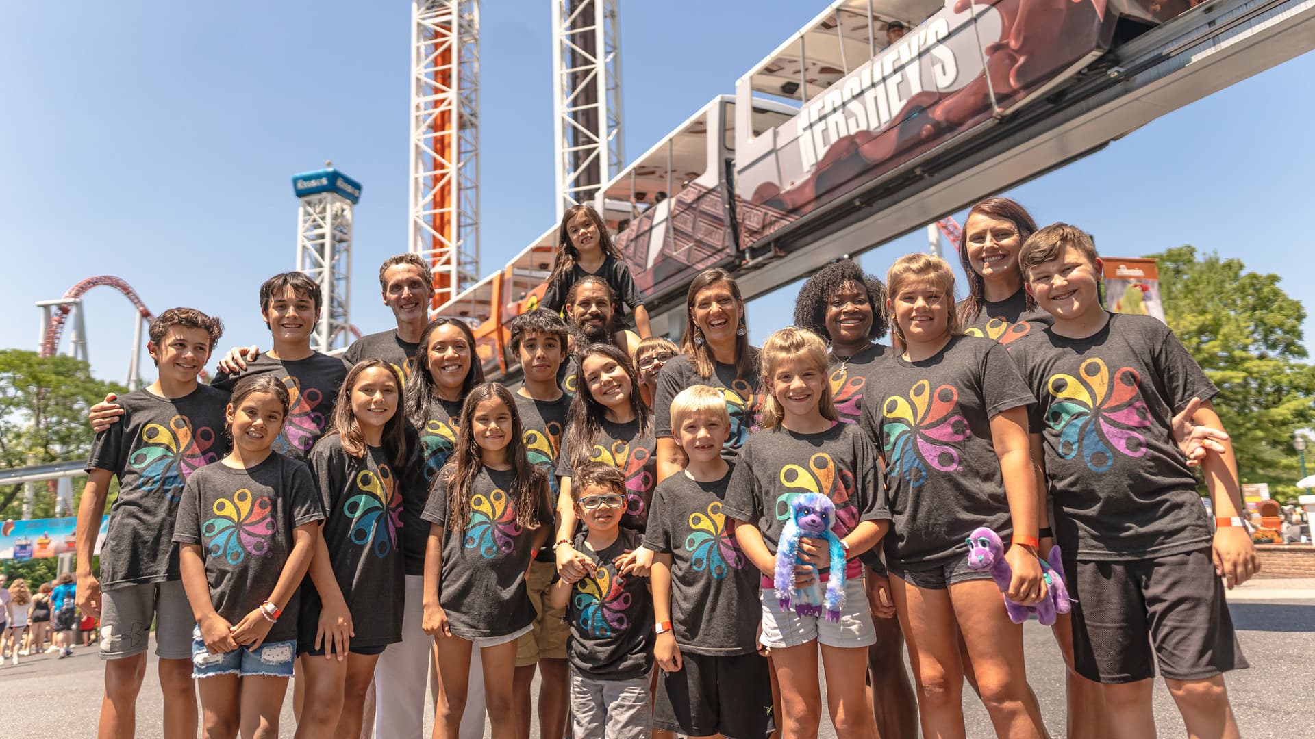 group posing in front of hersheys triple tower